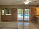 Living room with access to the pool and kitchen at 3151 Carlos Dr, Dunedin, FL 34698