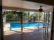 Inviting screened pool area with tiled patio at 3151 Carlos Dr, Dunedin, FL 34698