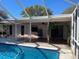 Pool and patio area with covered lanai at 3151 Carlos Dr, Dunedin, FL 34698