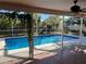 Relaxing screened pool and patio area at 3151 Carlos Dr, Dunedin, FL 34698