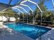 Large screened-in swimming pool at 3151 Carlos Dr, Dunedin, FL 34698