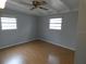 Bright bedroom featuring light gray walls and wood flooring at 4011 W Mango Ave, Tampa, FL 33616
