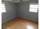 Bright bedroom featuring light wood flooring and neutral walls at 4011 W Mango Ave, Tampa, FL 33616