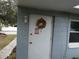 Side entrance to the light blue house at 4011 W Mango Ave, Tampa, FL 33616
