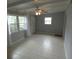 Bright living room with tile floors and ceiling fan at 4011 W Mango Ave, Tampa, FL 33616