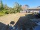 Large backyard with grassy lawn and partial fence at 4230 Lee Rd, Spring Hill, FL 34608