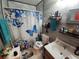 Clean bathroom with shower/tub combo and updated vanity at 4230 Lee Rd, Spring Hill, FL 34608