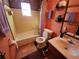 Bathroom features a tub, toilet and vanity at 4230 Lee Rd, Spring Hill, FL 34608