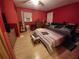 Main bedroom with king-size bed and wood flooring at 4230 Lee Rd, Spring Hill, FL 34608