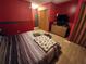 Main bedroom with king-size bed and wood flooring at 4230 Lee Rd, Spring Hill, FL 34608