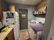 Laundry room with washer, dryer, and shelving at 4230 Lee Rd, Spring Hill, FL 34608