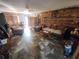 Living room with wood-paneled accent wall and comfy seating at 4230 Lee Rd, Spring Hill, FL 34608