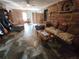Living room with wood-paneled accent wall and comfy seating at 4230 Lee Rd, Spring Hill, FL 34608