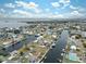 Aerial view of a waterfront community with canals and many houses at 4270 Paradise Cir, Hernando Beach, FL 34607