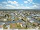 Aerial view of a waterfront community with canals and many houses at 4270 Paradise Cir, Hernando Beach, FL 34607