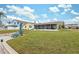 Spacious backyard with view of canal and house at 4270 Paradise Cir, Hernando Beach, FL 34607