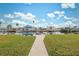 Waterfront backyard with dock and lush lawn at 4270 Paradise Cir, Hernando Beach, FL 34607
