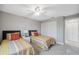 Guest bedroom with twin beds and ceiling fan at 4270 Paradise Cir, Hernando Beach, FL 34607