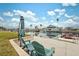 Relaxing waterfront dock with chairs and umbrella at 4270 Paradise Cir, Hernando Beach, FL 34607