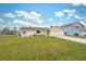 Single story home, yellow exterior, 2 car garage, and well maintained lawn at 4270 Paradise Cir, Hernando Beach, FL 34607