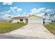 Ranch style home with attached garage and well-maintained lawn at 4270 Paradise Cir, Hernando Beach, FL 34607