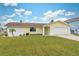 Newly renovated single-story house with a well-maintained lawn at 4270 Paradise Cir, Hernando Beach, FL 34607