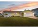Updated single story home with a landscaped lawn and attached garage at 4270 Paradise Cir, Hernando Beach, FL 34607