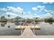 Private floating dock with steps and boat at 4270 Paradise Cir, Hernando Beach, FL 34607