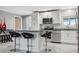 Stylish kitchen featuring white cabinets and a large granite island at 4270 Paradise Cir, Hernando Beach, FL 34607