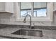 Modern kitchen sink with a stainless steel faucet at 4270 Paradise Cir, Hernando Beach, FL 34607