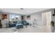 Spacious living room with blue sectional sofa and water view at 4270 Paradise Cir, Hernando Beach, FL 34607