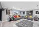 Spacious living room featuring gray sofas and stylish decor at 4270 Paradise Cir, Hernando Beach, FL 34607