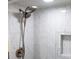 Clean shower with marble tile and dual shower heads at 4270 Paradise Cir, Hernando Beach, FL 34607
