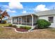 Home exterior showcasing a screened porch at 4380 Lamson Ave, Spring Hill, FL 34608