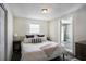 Bright bedroom with window and neutral decor at 4602 W Hawthorne Rd, Tampa, FL 33611
