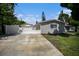 Home exterior with driveway and garage at 4602 W Hawthorne Rd, Tampa, FL 33611