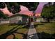 Charming one-story home with gray siding, manicured lawn, and walkway at 4602 W Hawthorne Rd, Tampa, FL 33611