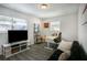Home office with large TV and ample workspace at 4602 W Hawthorne Rd, Tampa, FL 33611