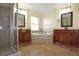 Large bathroom with corner tub, double sinks, and hardwood floors at 4634 Mapletree Loop, Wesley Chapel, FL 33544
