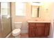 Clean bathroom with shower, toilet and wood vanity at 4634 Mapletree Loop, Wesley Chapel, FL 33544