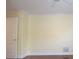 Empty bedroom with hardwood floors and neutral walls at 4634 Mapletree Loop, Wesley Chapel, FL 33544