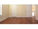 Well-lit bedroom with hardwood floors and ample closet space at 4634 Mapletree Loop, Wesley Chapel, FL 33544