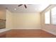 Large bonus room featuring hardwood floors and ample natural light at 4634 Mapletree Loop, Wesley Chapel, FL 33544