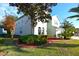 Two-story house with nicely landscaped yard at 4634 Mapletree Loop, Wesley Chapel, FL 33544