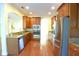 Modern kitchen with stainless steel appliances and wood cabinetry at 4634 Mapletree Loop, Wesley Chapel, FL 33544