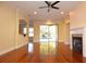 Living area with hardwood floors, fireplace and pool view at 4634 Mapletree Loop, Wesley Chapel, FL 33544