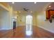 Spacious living room with hardwood floors and fireplace at 4634 Mapletree Loop, Wesley Chapel, FL 33544