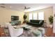 Spacious living room featuring hardwood floors and stylish furniture at 4634 Mapletree Loop, Wesley Chapel, FL 33544