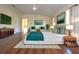 Spacious main bedroom with hardwood floors and stylish decor at 4634 Mapletree Loop, Wesley Chapel, FL 33544