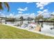 Waterfront view with private dock and boats at 54 Schooner Dr # 54, Palm Harbor, FL 34683